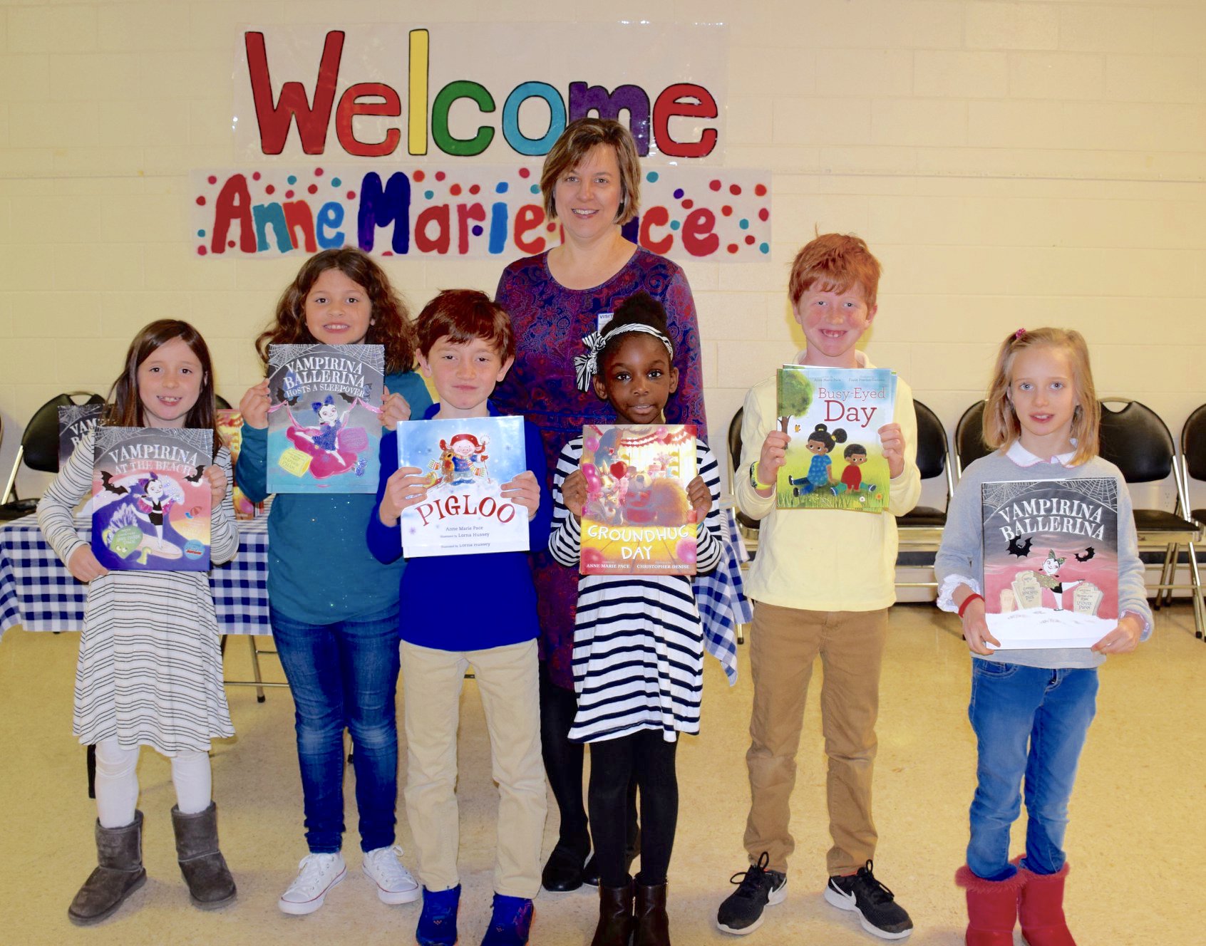 A librarian reads to Lower School students.